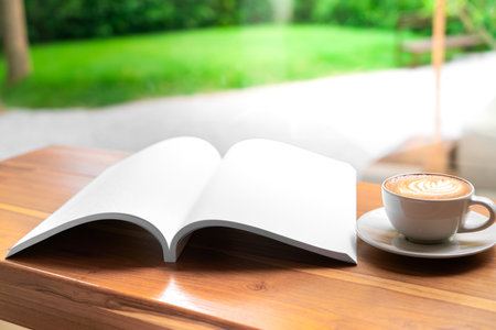 Blank mock up (catalog, magazines, book) and cup of coffee on wooden background. Mock up for design.の写真素材