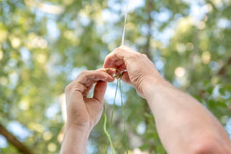 Hands tie a knot