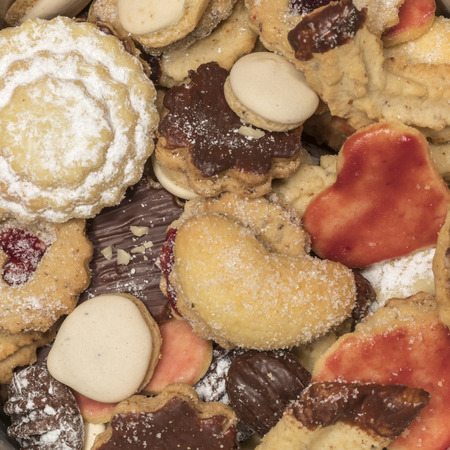 colorful mix of homemade christmas cookies / biscuits as backgroundの写真素材