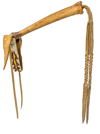 Coup-Stick of the Native American Indian of buffalo bone and leather isolated on whiteの写真素材