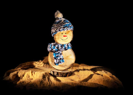 Handmade wooden snowman with crochet hat and scarfの写真素材