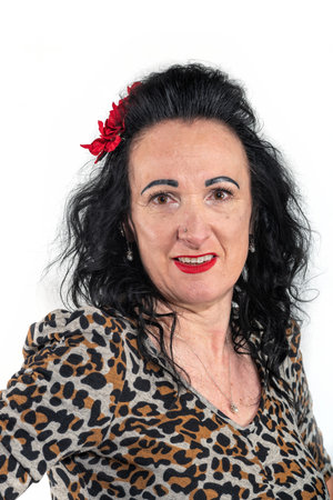 Portrait of a beautiful woman in leopard print dress on white backgroundの写真素材
