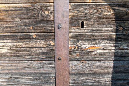 Old wooden door with rivets. Texture of the old wooden door.の写真素材