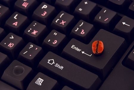 		 grain of coffee on the keyboardの写真素材