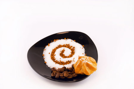 cake, coffee grains and sugar on a plateの写真素材