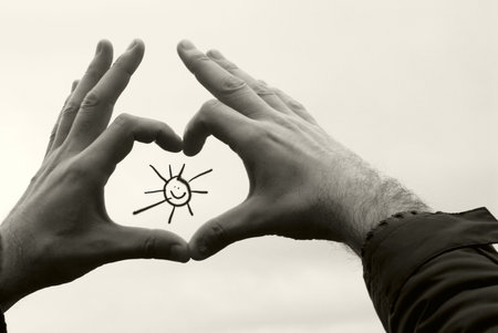 symbol of the sun in the hands of men