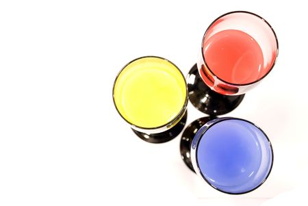  top view on the three glasses with colored waterの写真素材