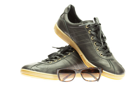 black athletic shoes isolated on whiteの写真素材