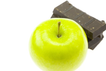 apple and chocolate isolated on whiteの写真素材