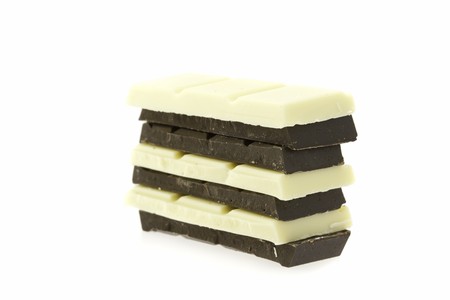 dark and white chocolate isolated on whiteの写真素材