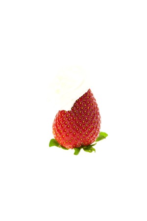 strawberries with whipped cream isolated on whiteの写真素材