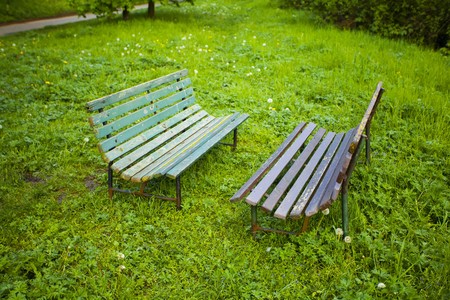 two benches on the background of green grassの写真素材