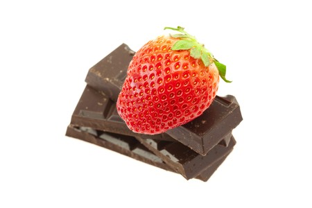 Strawberry on the mountain of chocolate isolated on whiteの写真素材
