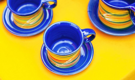 ceramic cups on a yellow backgroundの写真素材