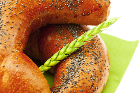 bread with poppy seeds and the spike isolated on whiteの写真素材