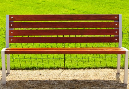bench against a background of green grassの写真素材