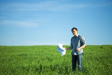 man throws the paper in the fieldの写真素材