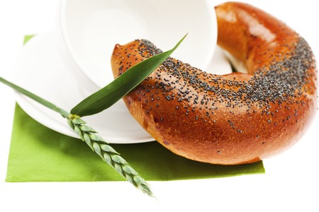 loaf with poppy seeds cup  and the spike isolated on whiteの写真素材