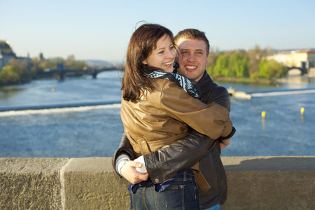 young couple on the Charles Bridge on the skylineの写真素材