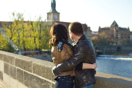 young couple on the Charles Bridge on the skylineの写真素材
