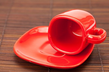 red cup  on a bamboo matの写真素材