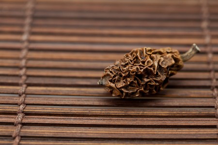 Dried walnut on a bamboo matの写真素材