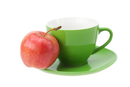 cup, saucer and apples isolated on whiteの写真素材
