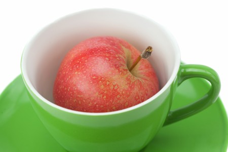 cup, saucer and apples isolated on whiteの写真素材