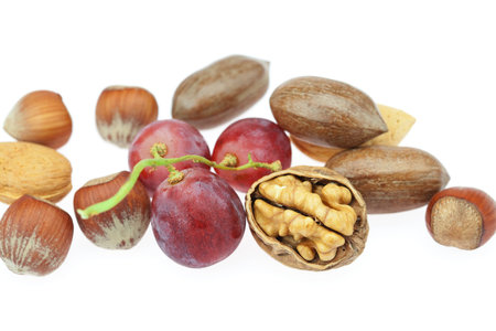 nuts and grapes isolated on white