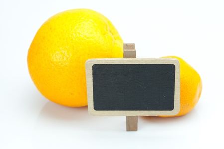 orange, mandarin and board isolated on whiteの写真素材