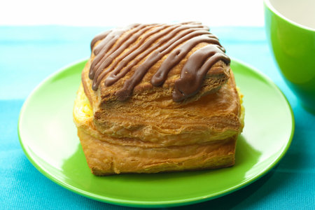 cake with chocolate on a plate on the fabric