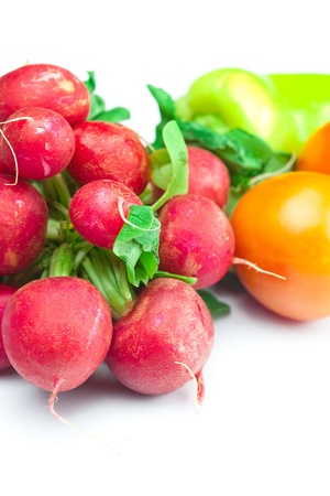 radish, tomato and pepper isolated on whiteの写真素材