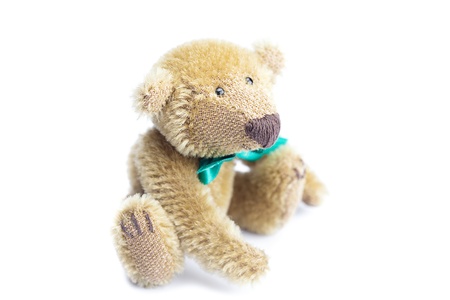 Teddy Bear with bow isolated on whiteの写真素材