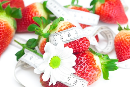 background of red big juicy ripe strawberry and flowerの写真素材