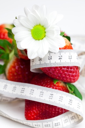 background of red big juicy ripe strawberry and flowerの写真素材