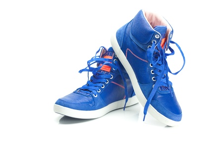 beautiful blue athletic shoes isolated on whiteの写真素材
