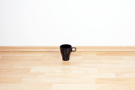 cup standing on the floor in the roomの写真素材