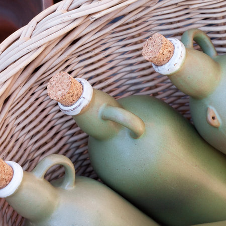 clay bottles in the basket at the fairの写真素材