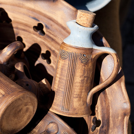 clay bottles in the basket at the fairの写真素材
