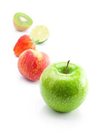 big juicy red ripe strawberries,apple,lime,peach and kiwi  isolated on whiteの写真素材