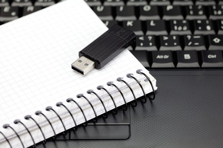 laptop keyboard, notebook and flash drive