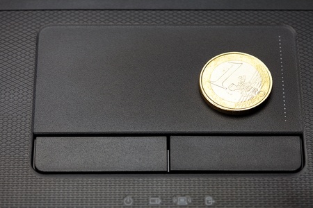 laptop keyboard and coin euroの写真素材