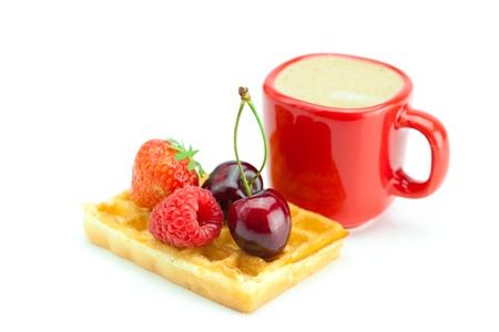 cappuccino cup, waffles, cherries, strawberries and raspberries isolated on whiteの写真素材