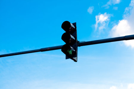 traffic lights against the blue sky