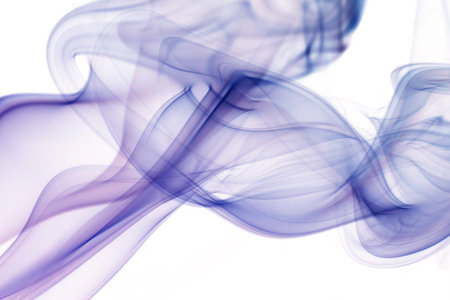 wave and smoke of different colors isolated on whiteの写真素材