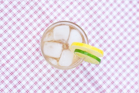 water with lemon and lime in a glass with iceの写真素材