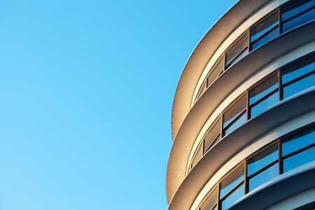 Beautiful modern office building against the blue skyの写真素材