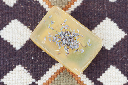 lavender and soap on ethnic mat