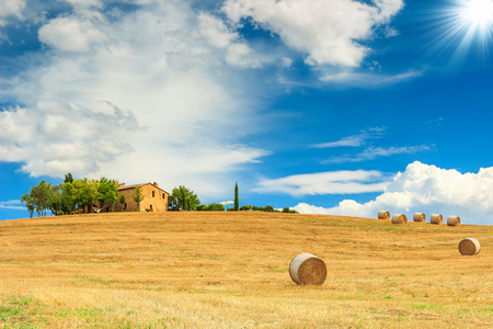 Stunning Tuscany landscape,typical stone house and hay bale on the hills,near Val d'Orcia,Italy,Europeの写真素材