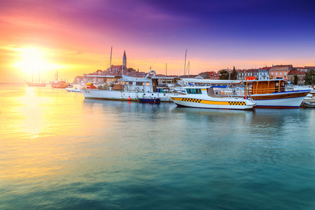 Stunning romantic old town of Rovinj and famous fishing harbor with magical sunset,Istrian Peninsula,Croatia,Europeのeditorial素材